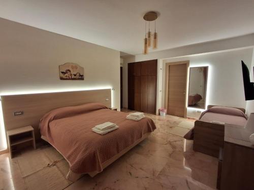 a bedroom with a bed with a light on it at Beautiful Dreams in San Giorgio a Liri