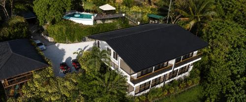an overhead view of a house with a black roof at Vista Naranja Retreat in Santa Teresa Beach