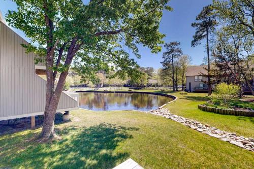 a pond in a yard next to a house at Sea Colony --- 3404 Round Robin Way in Bethany Beach