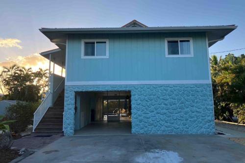 a house with a blue facade at Franzone Fun in Saint James City