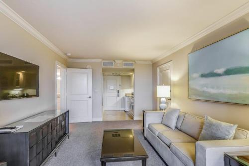 a living room with a couch and a table at Marco Beach Ocean Resort Condominiums #605 in Marco Island
