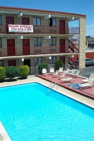 a large swimming pool in front of a hotel at Cloud 9 Inn - Beach Hotel in Seaside Heights