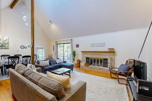 a living room with a couch and a fireplace at Battersea on the Canal in Ocean Pines