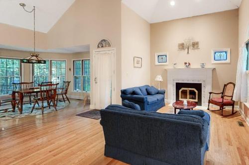a living room with a couch and a fireplace at Beaconhill Road 68 in Ocean Pines