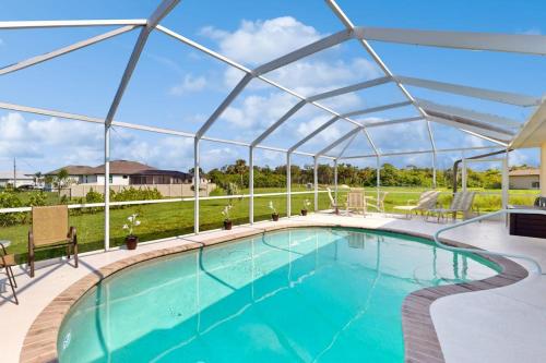a large swimming pool with a clear cover over it at Sunny Way in Rotunda-West