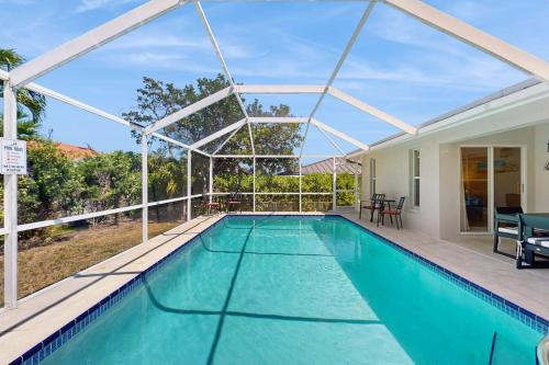 a swimming pool in a house with a pool at Marco Sands in Marco Island