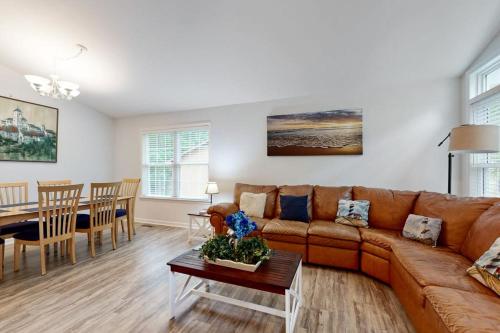 a living room with a couch and a table at Coral Shells in Ocean Pines