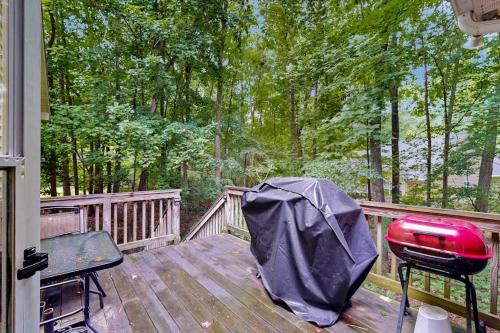 a deck with a grill and a bbq on it at Coral Shells in Ocean Pines