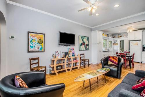 a living room with a couch and a table at Hydrangea House in New Buffalo