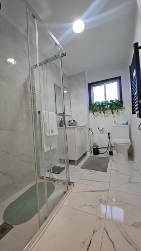 a bathroom with a shower and a sink at Odivelas Home in Odivelas
