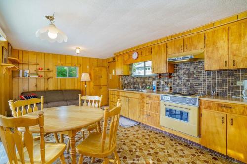 a kitchen with a wooden table and a dining room at Grandma's Sandbox in Beulah