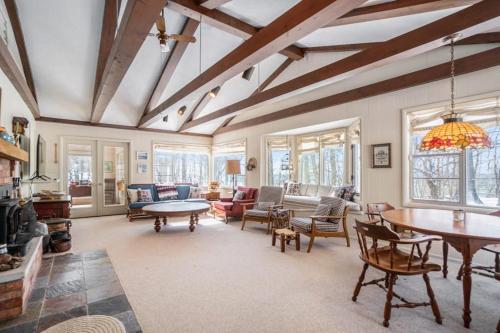a large living room with a table and chairs at Johnson Cottage in Glenn