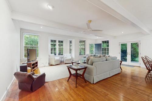 a living room with a couch and a table at Family Tides in Barnstable