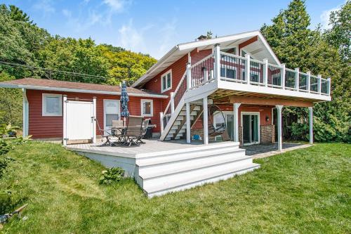 a large house with a deck and a porch at Cherry Fish North in Beulah