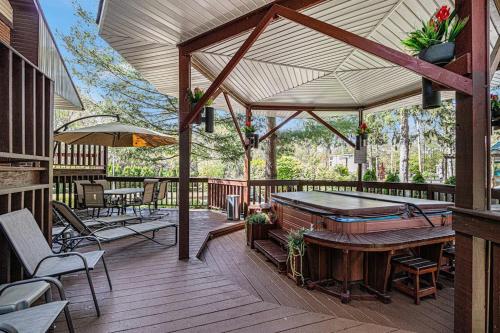 an outdoor deck with a ping pong table at The Townline House in Union Pier