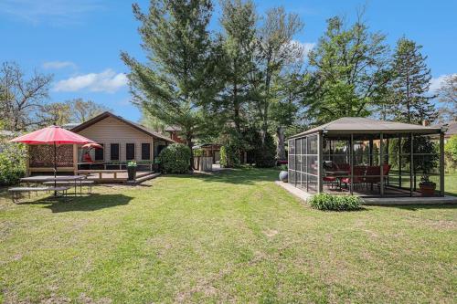 a backyard with a gazebo and a house at The Townline House in Union Pier