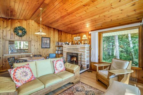 a living room with a couch and a fireplace at Serenity in Honor