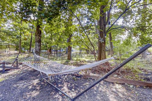 a hammock sitting in the middle of a park at Mt McSauba A Frame Cottage in Charlevoix