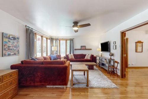 a living room with a couch and a table at Steps from the Sand in Union Pier