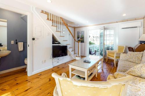 a living room with a couch and a table at Hammock Hideaway in Mashpee