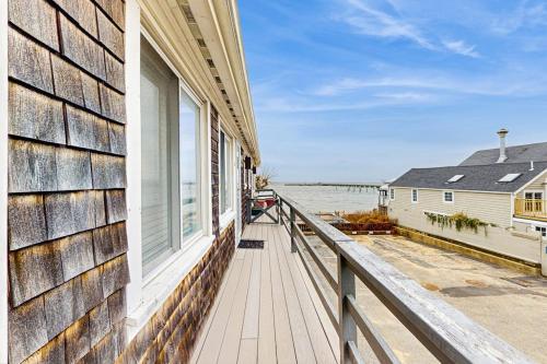a balcony of a house with a view of the ocean at Provincetown Waterfront Studio in Provincetown