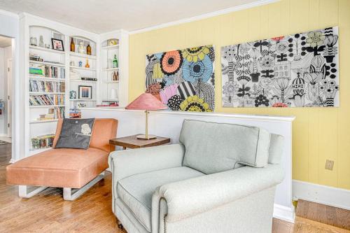 a living room with a couch and a chair at Birdie Bungalow in Saugatuck