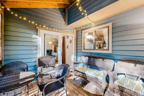 a room with blue walls and wicker chairs at Seafarer 7 in Ocean Pines