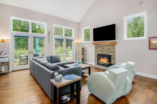 a living room with a couch and a fireplace at Appy Place in South Haven