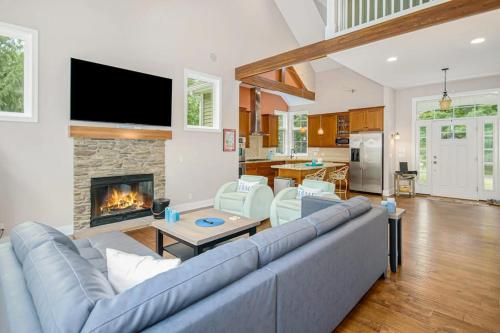 a living room with a couch and a fireplace at Appy Place in South Haven