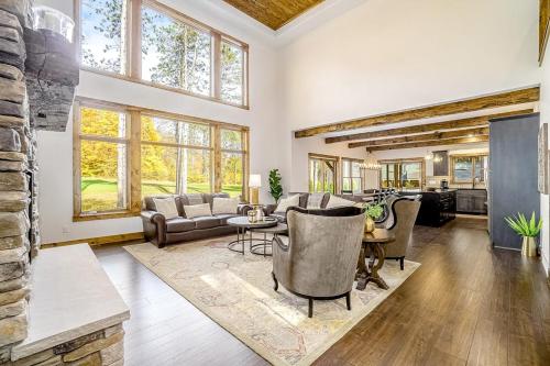 a living room with a couch and chairs and a table at Buckaroo in Thompsonville