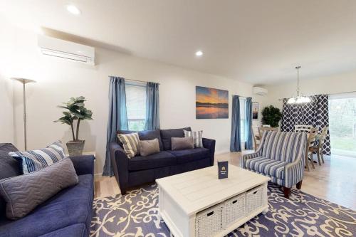 a living room with two couches and a table at Oak Bluffs Beauty in Oak Bluffs
