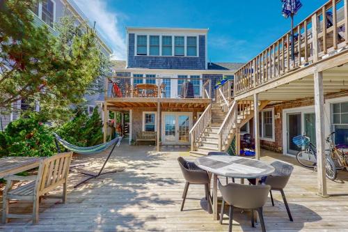 a patio with a hammock and a table and chairs at The Lighthouse in Provincetown