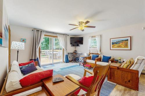 a living room with a couch and a table at Old Orchard in Edgartown