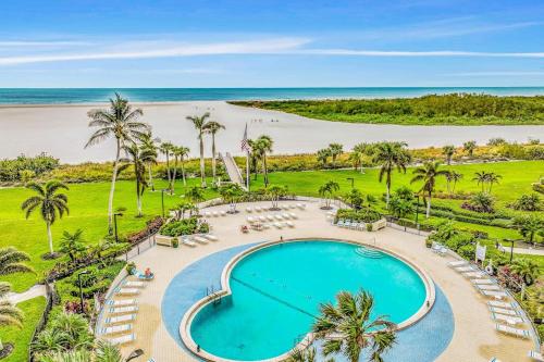 an aerial view of a pool and the beach at Waves & Palms Oasis in Marco Island