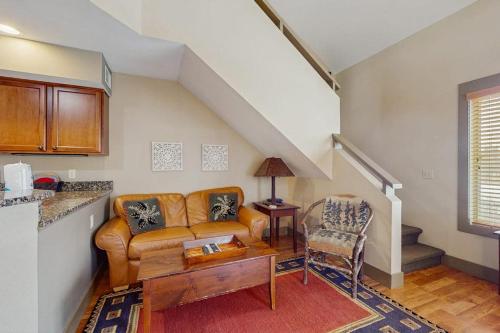 a living room with a couch and a table at WinterGreen Condo, #522 in Thompsonville