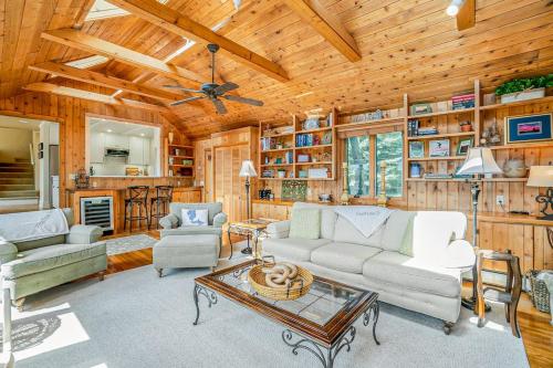 a living room with a couch and a table at Birchwood: Meadows Bliss in Harbor Springs