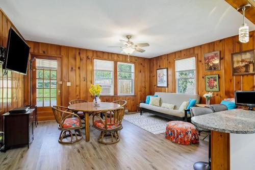 a living room with a table and a couch at Lake Michigan Charmer in Union Pier