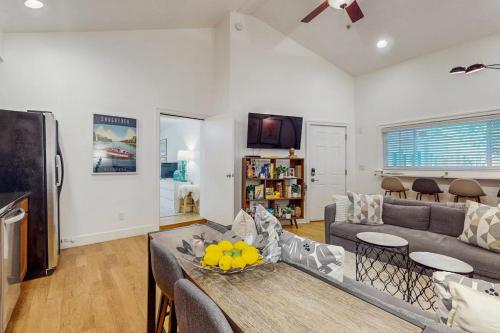 a living room with a couch and a table at Arrowhead Resort - Undeniably Darling in Saugatuck