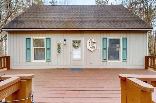 a small white house with a wreath on the door at Crystal Mountain Retreat in Thompsonville