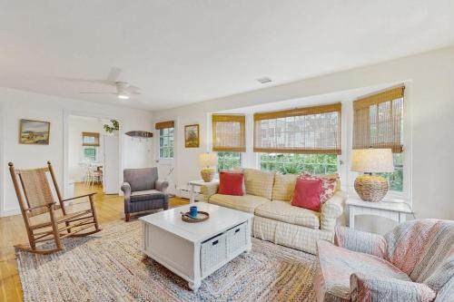 a living room with a couch and a table at Cozy Corner in Edgartown