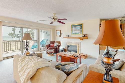 a living room with a couch and a table at South Beach 53 in Glen Arbor