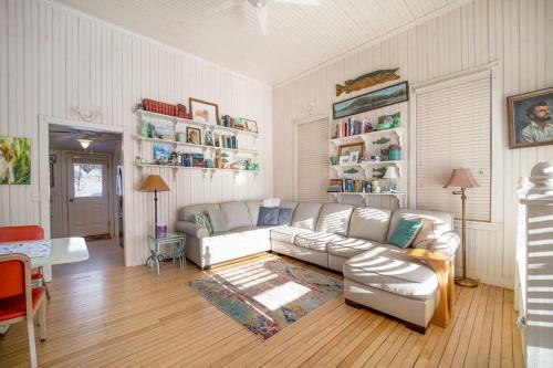 a living room with a couch and a table at Lake Daze in Boyne City
