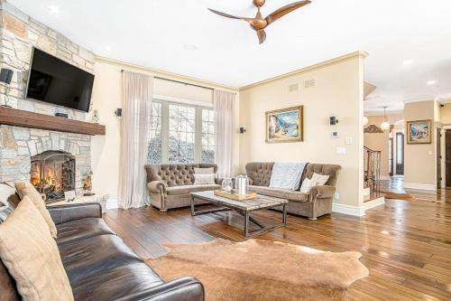 a living room with a couch and a fireplace at Eagles Nest in New Buffalo