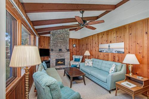 a living room with a blue couch and a fireplace at Camp David in Frankfort
