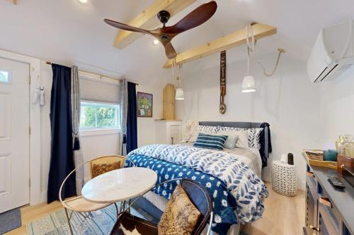 a bedroom with a bed and a ceiling fan at Sankofa Studio in Oak Bluffs