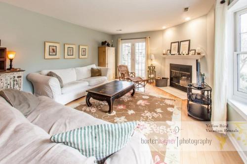 a living room with a couch and a table at La Colita in Harbert