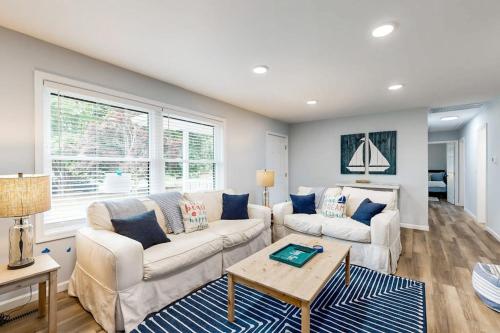 a living room with two couches and a table at Mill Run Estates --- 31863 Mill Run Dr in Ocean View
