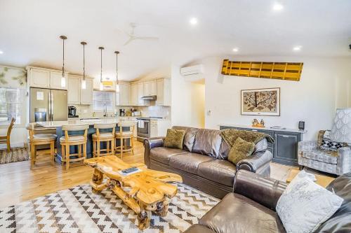 a living room with a couch and a table at Red Pine Retreat in Thompsonville