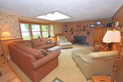 a living room with two couches and a fireplace at Thorogood Glen in Empire