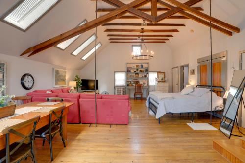 a living room with a couch and a bed at Pet-Friendly Loft Vacation Rental w/ Fire Pit! in Bemus Point